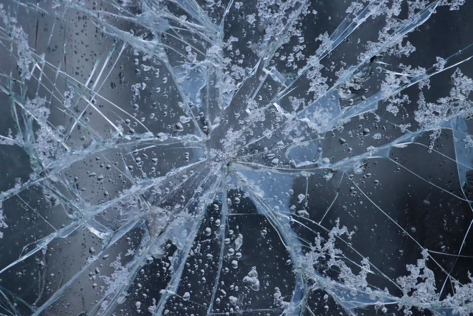 Cracked car windshield requiring professional windshield replacement